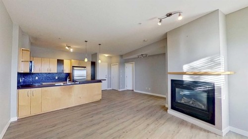 121-69 Springborough Court Sw, Calgary, AB - Indoor With Fireplace