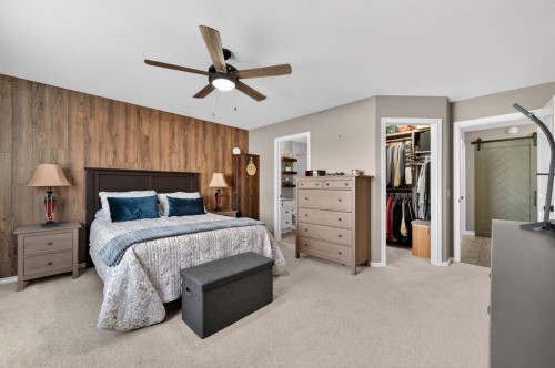 26 Mackenzie Way, Carstairs, AB - Indoor Photo Showing Bedroom
