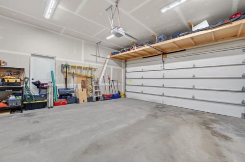 26 Mackenzie Way, Carstairs, AB - Indoor Photo Showing Garage