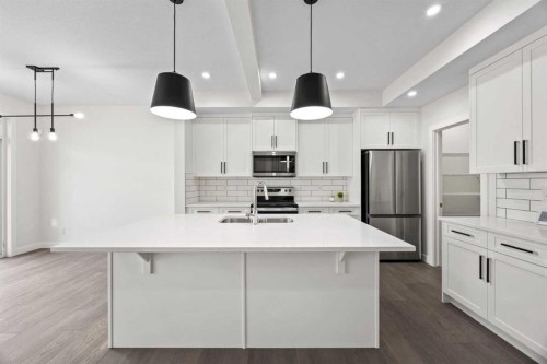108 Waterford Way, Chestermere, AB - Indoor Photo Showing Kitchen With Stainless Steel Kitchen With Double Sink With Upgraded Kitchen