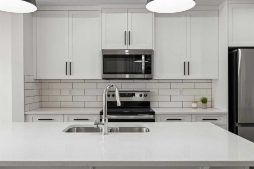 108 Waterford Way, Chestermere, AB - Indoor Photo Showing Kitchen With Stainless Steel Kitchen With Double Sink With Upgraded Kitchen