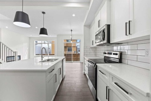 108 Waterford Way, Chestermere, AB - Indoor Photo Showing Kitchen With Double Sink With Upgraded Kitchen