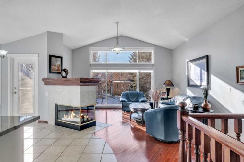 78 Mckenzie Lake Place Se, Calgary, AB - Indoor Photo Showing Living Room With Fireplace