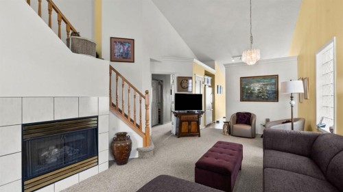 80 Arbour Grove Close Nw, Calgary, AB - Indoor Photo Showing Living Room With Fireplace