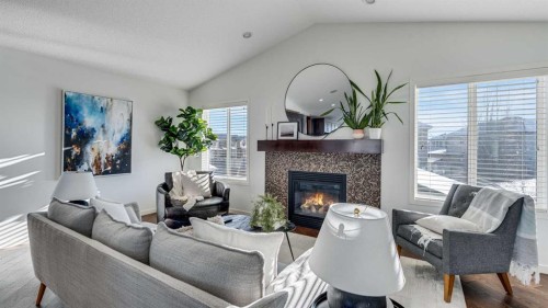 389 Cranberry Circle Se, Calgary, AB - Indoor Photo Showing Living Room With Fireplace