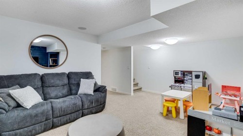 389 Cranberry Circle Se, Calgary, AB - Indoor Photo Showing Living Room