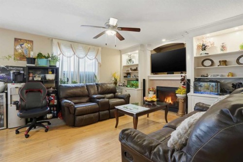 197 West Creek Boulevard, Chestermere, AB - Indoor Photo Showing Living Room With Fireplace