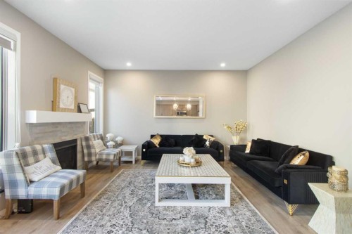 17 Carrington Manor Nw, Calgary, AB - Indoor Photo Showing Living Room With Fireplace