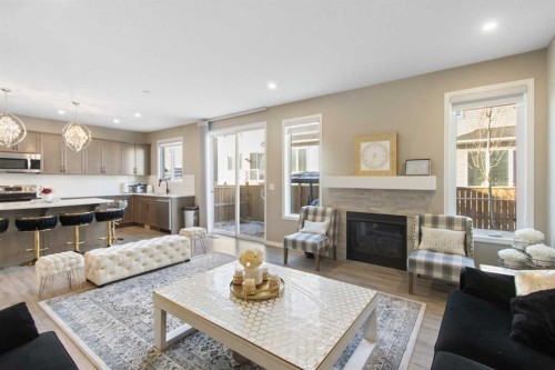 17 Carrington Manor Nw, Calgary, AB - Indoor Photo Showing Living Room With Fireplace