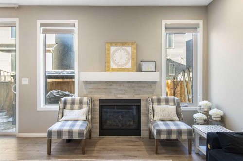 17 Carrington Manor Nw, Calgary, AB - Indoor Photo Showing Living Room With Fireplace