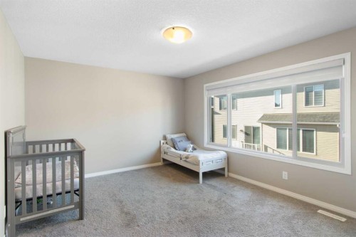 17 Carrington Manor Nw, Calgary, AB - Indoor Photo Showing Bedroom