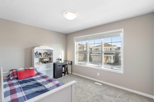 17 Carrington Manor Nw, Calgary, AB - Indoor Photo Showing Bedroom