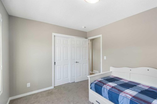 17 Carrington Manor Nw, Calgary, AB - Indoor Photo Showing Bedroom