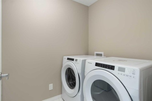 17 Carrington Manor Nw, Calgary, AB - Indoor Photo Showing Laundry Room