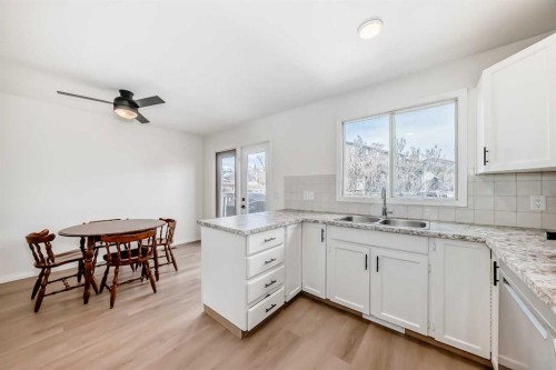 212 Cedarbrook Bay Sw, Calgary, AB - Indoor Photo Showing Kitchen With Double Sink