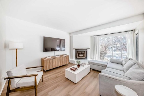 212 Cedarbrook Bay Sw, Calgary, AB - Indoor Photo Showing Living Room With Fireplace