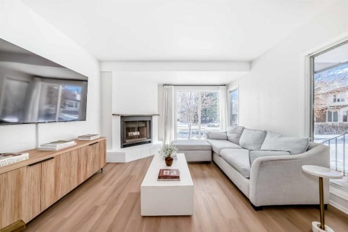 212 Cedarbrook Bay Sw, Calgary, AB - Indoor Photo Showing Living Room With Fireplace
