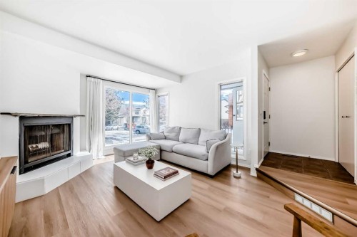212 Cedarbrook Bay Sw, Calgary, AB - Indoor Photo Showing Living Room With Fireplace