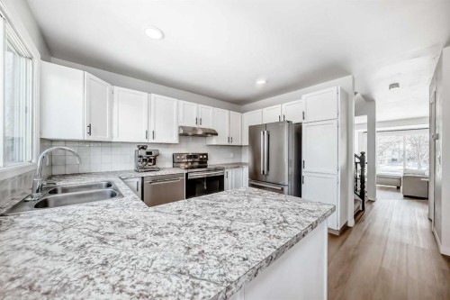 212 Cedarbrook Bay Sw, Calgary, AB - Indoor Photo Showing Kitchen With Double Sink With Upgraded Kitchen
