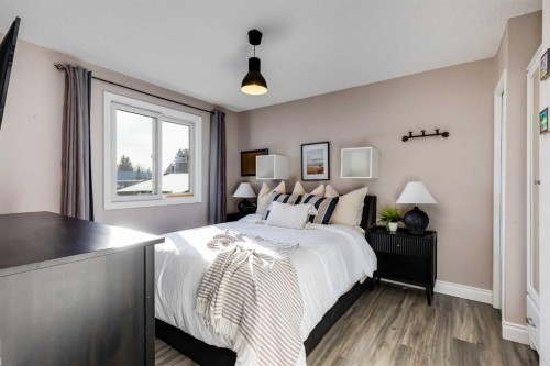 1205 Meadowbrook Drive Se, Airdrie, AB - Indoor Photo Showing Bedroom