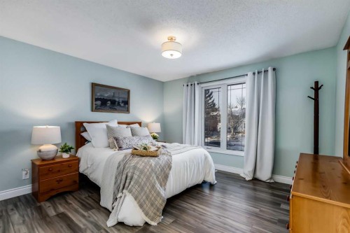 1205 Meadowbrook Drive Se, Airdrie, AB - Indoor Photo Showing Bedroom