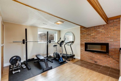 1205 Meadowbrook Drive Se, Airdrie, AB - Indoor Photo Showing Gym Room