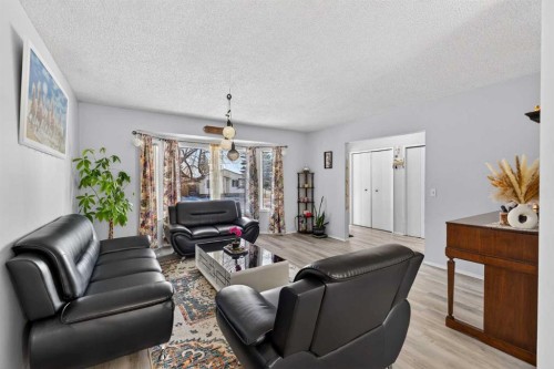 195 Fallswater Road Ne, Calgary, AB - Indoor Photo Showing Living Room