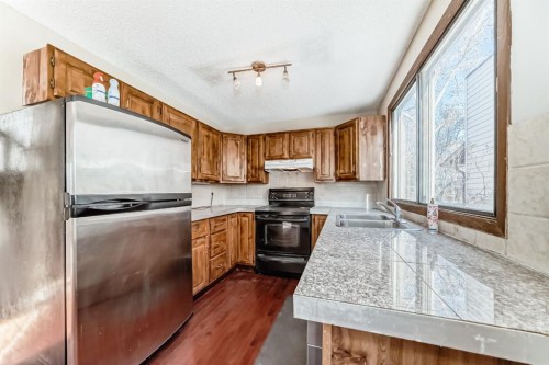 8007 Ranchview Drive Nw, Calgary, AB - Indoor Photo Showing Kitchen With Double Sink