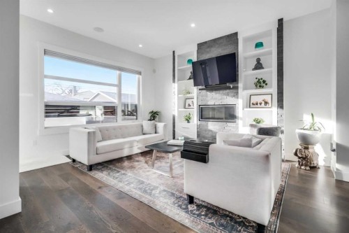 2415 25 Avenue Nw, Calgary, AB - Indoor Photo Showing Living Room With Fireplace