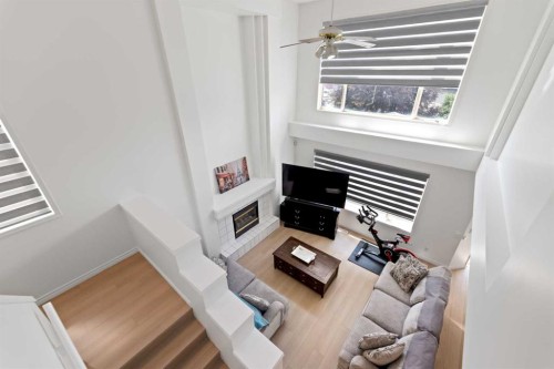 7 Country Hills Park Nw, Calgary, AB - Indoor Photo Showing Other Room With Fireplace