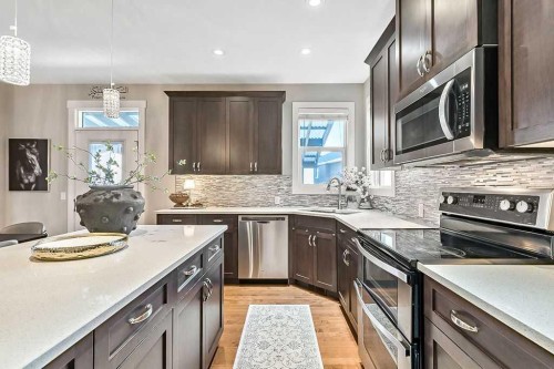 112 Kinniburgh Close, Chestermere, AB - Indoor Photo Showing Kitchen With Upgraded Kitchen