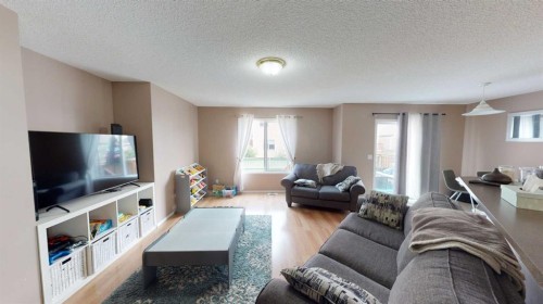 91 Royal Elm Way Nw, Calgary, AB - Indoor Photo Showing Living Room