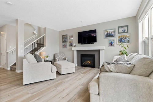 26 Marquis Heights Se, Calgary, AB - Indoor Photo Showing Living Room With Fireplace