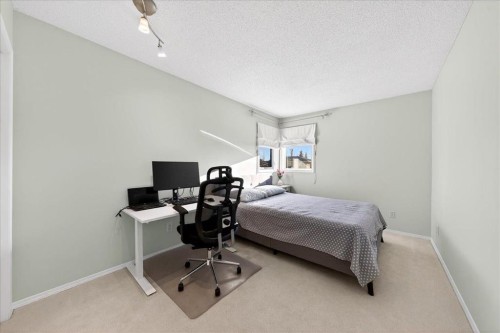 137 Woodbrook Road Sw, Calgary, AB - Indoor Photo Showing Bedroom