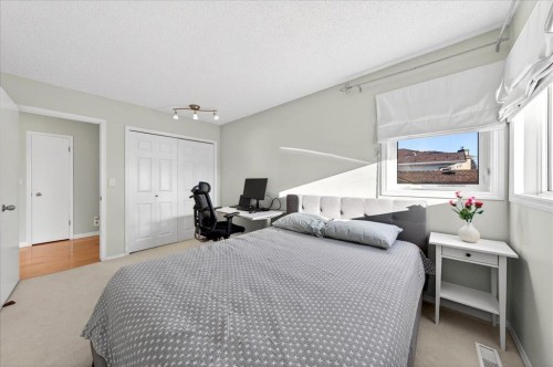 137 Woodbrook Road Sw, Calgary, AB - Indoor Photo Showing Bedroom