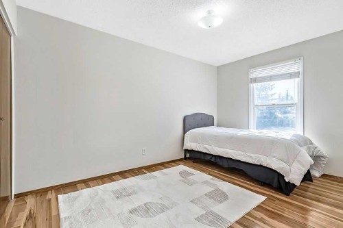 107 Lock Crescent, Okotoks, AB - Indoor Photo Showing Bedroom
