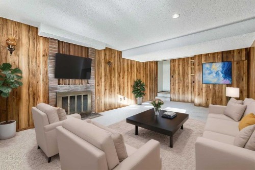 107 Lock Crescent, Okotoks, AB - Indoor Photo Showing Living Room With Fireplace
