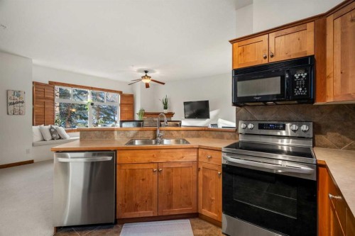 201-85 Dyrgas Gate, Canmore, AB - Indoor Photo Showing Kitchen With Double Sink