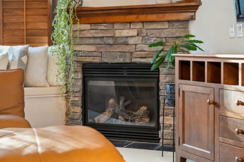 201-85 Dyrgas Gate, Canmore, AB - Indoor Photo Showing Living Room With Fireplace
