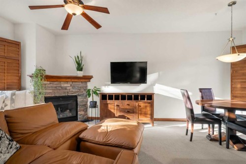 201-85 Dyrgas Gate, Canmore, AB - Indoor Photo Showing Living Room With Fireplace