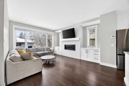 1410 21 Avenue Nw, Calgary, AB - Indoor Photo Showing Living Room With Fireplace