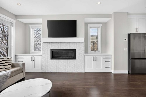 1410 21 Avenue Nw, Calgary, AB - Indoor Photo Showing Living Room With Fireplace