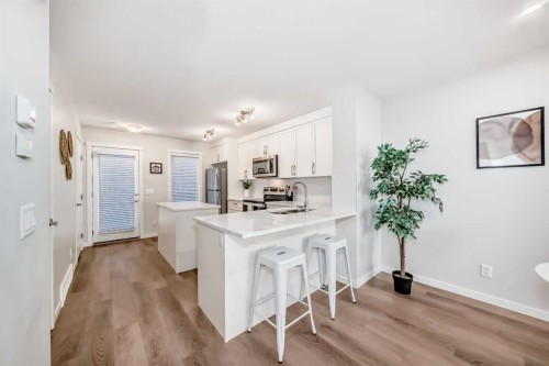 307-474 Seton Circle Se, Calgary, AB - Indoor Photo Showing Kitchen With Upgraded Kitchen