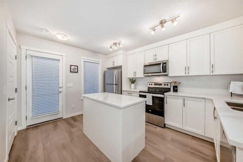 307-474 Seton Circle Se, Calgary, AB - Indoor Photo Showing Kitchen With Stainless Steel Kitchen With Upgraded Kitchen
