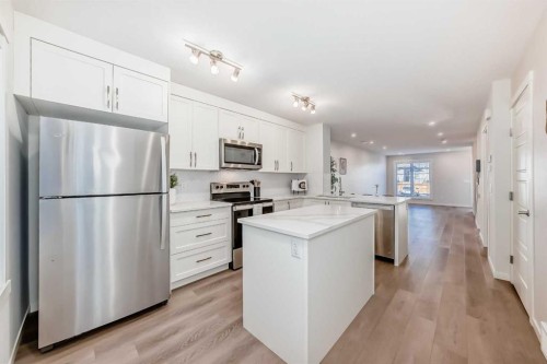 307-474 Seton Circle Se, Calgary, AB - Indoor Photo Showing Kitchen With Stainless Steel Kitchen With Upgraded Kitchen
