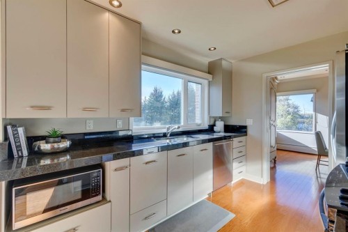 3N-222 Eagle Ridge Drive Sw, Calgary, AB - Indoor Photo Showing Kitchen With Double Sink