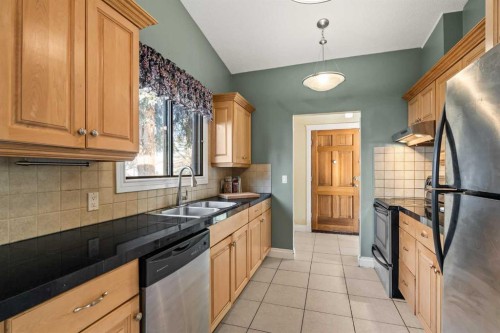 1343 Berkley Drive Nw, Calgary, AB - Indoor Photo Showing Kitchen With Double Sink