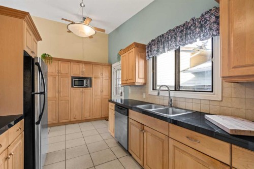 1343 Berkley Drive Nw, Calgary, AB - Indoor Photo Showing Kitchen With Double Sink