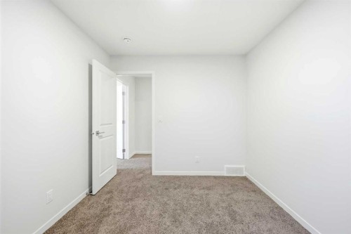 185 Edith Green Nw, Calgary, AB - Indoor Photo Showing Other Room