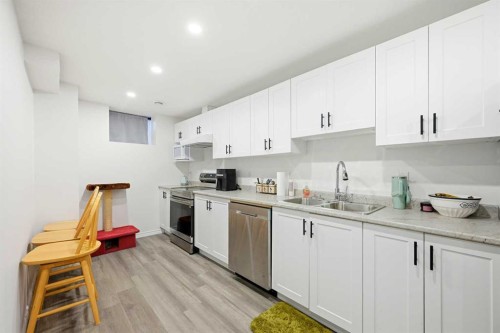 185 Edith Green Nw, Calgary, AB - Indoor Photo Showing Kitchen With Double Sink